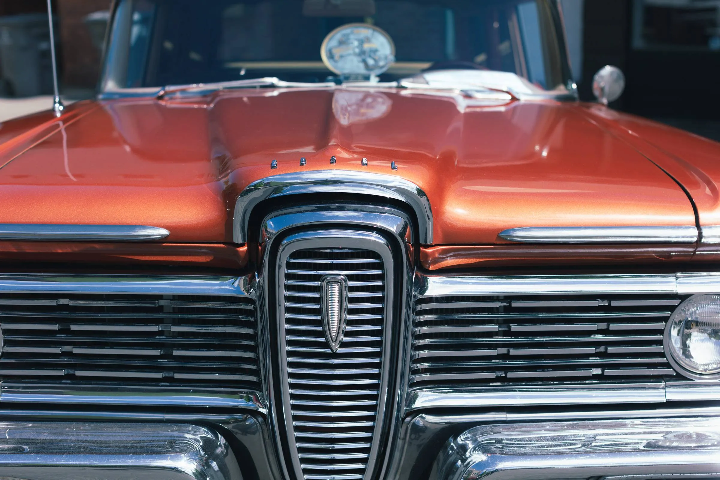 A view of the front grill of a red Edsel Station Wagon at the 2023 Gold Rush Car Show